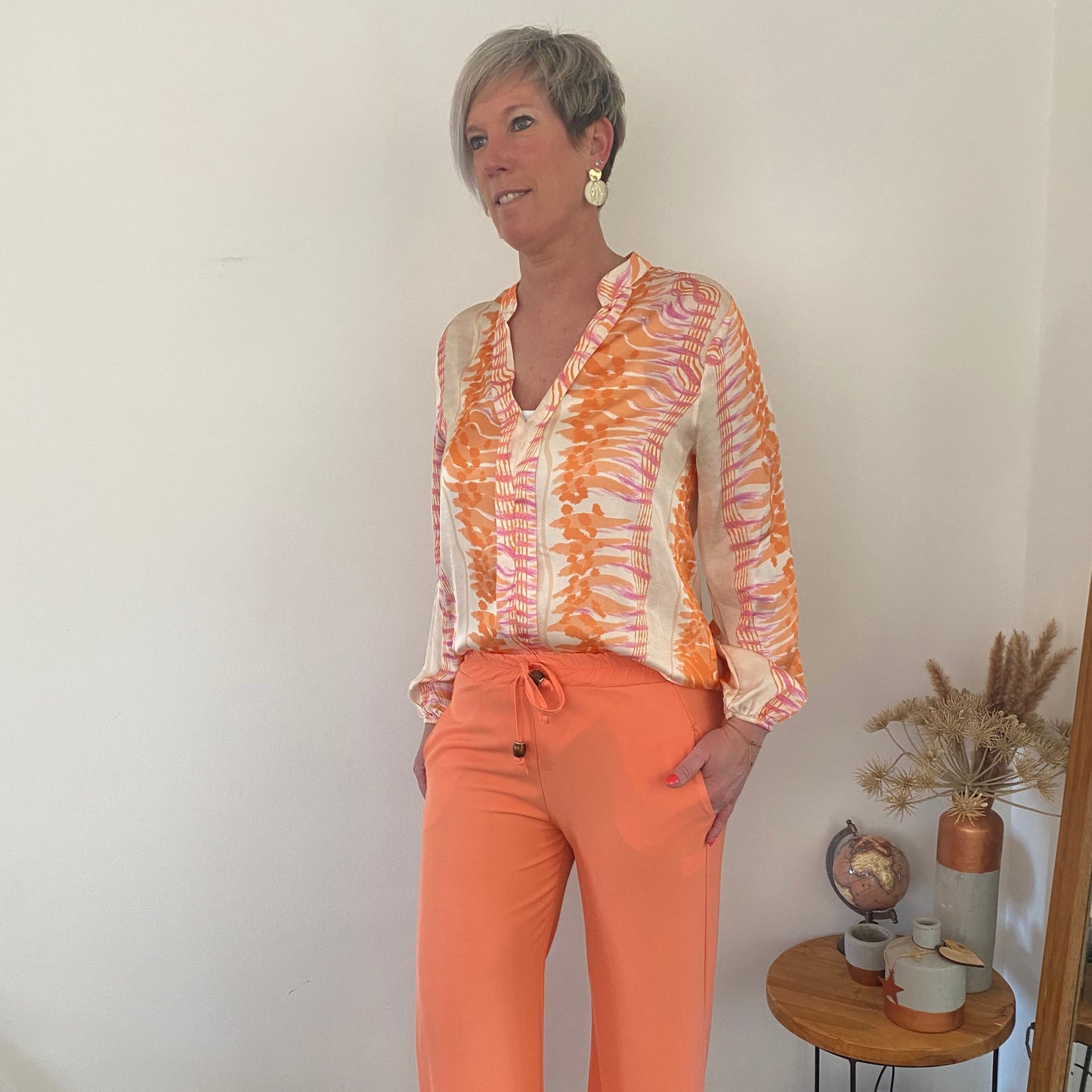 Blouse beige met oranje