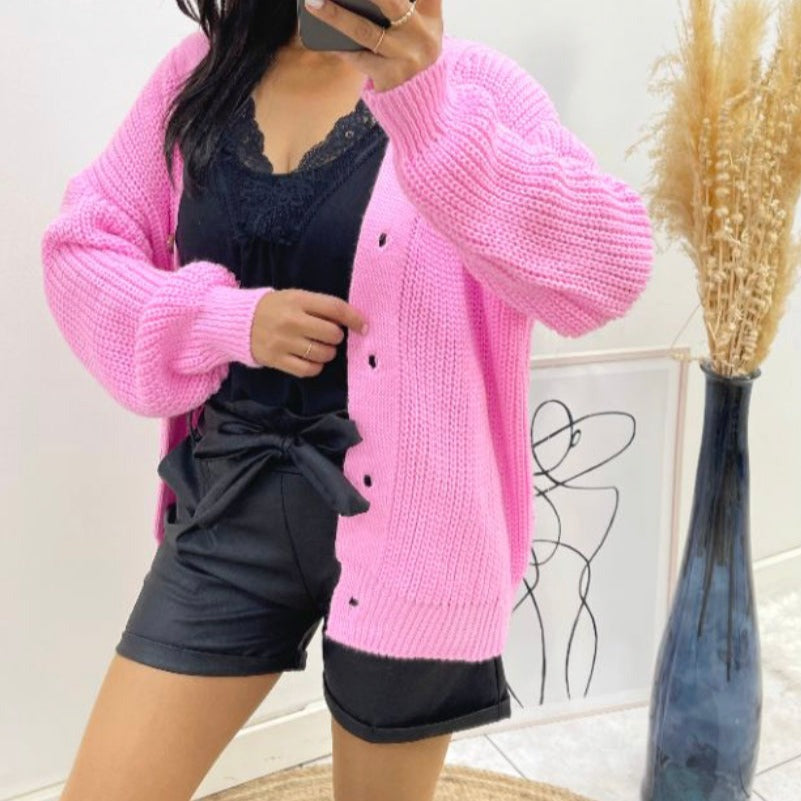 Roze vest met knopen